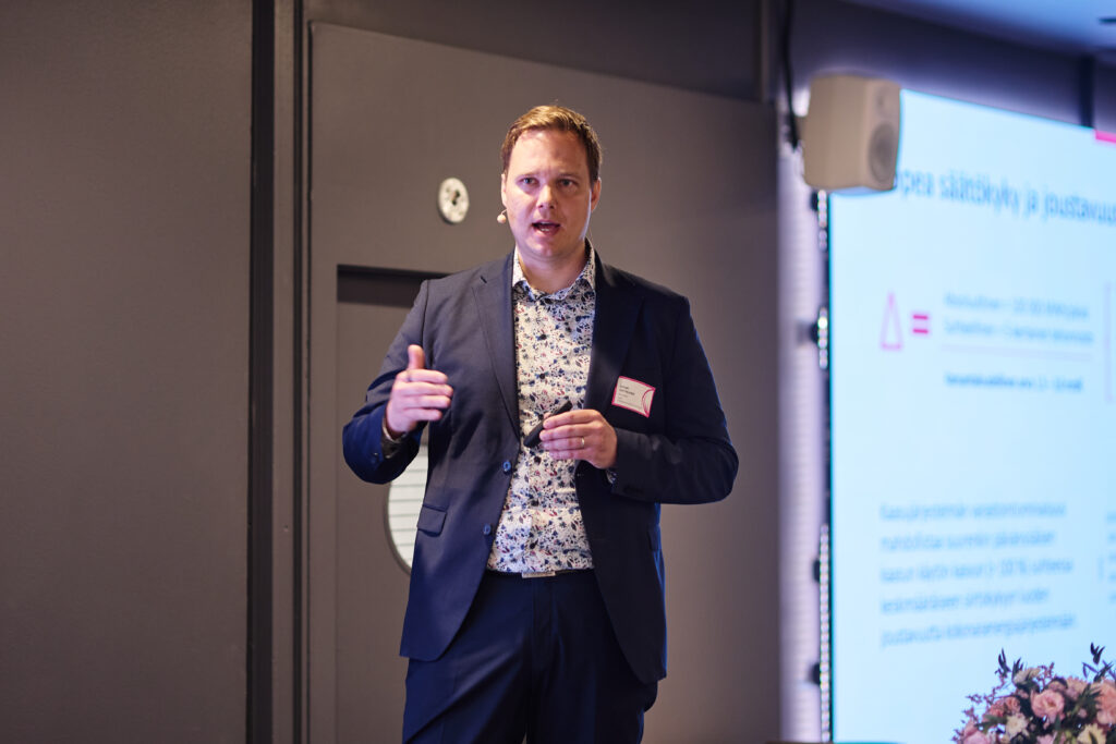 Janne Grönlund speaking on stage at the Future of the Gases event.