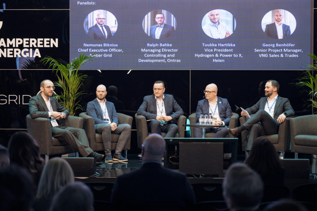 The panel discussion featured Georg Benhöfer from VNG (left), Tuukka Hartikka from Helen, Ralph Bahke from Ontras, and Nemunas Biknius from Amber Grid. The panel was moderated by Joonas Laitila from Gasgrid.